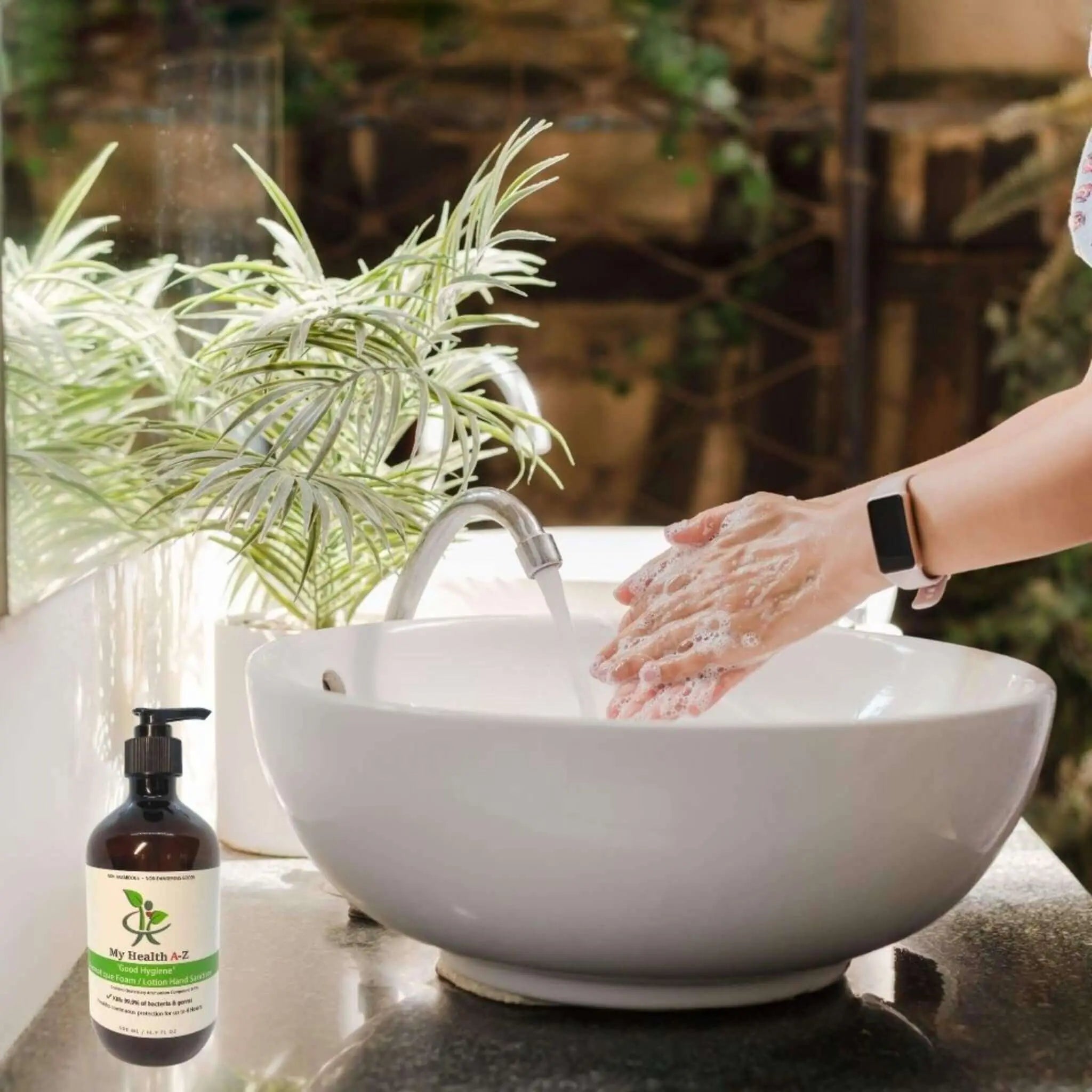 Woman washing her hands in basin on the left a bottle &