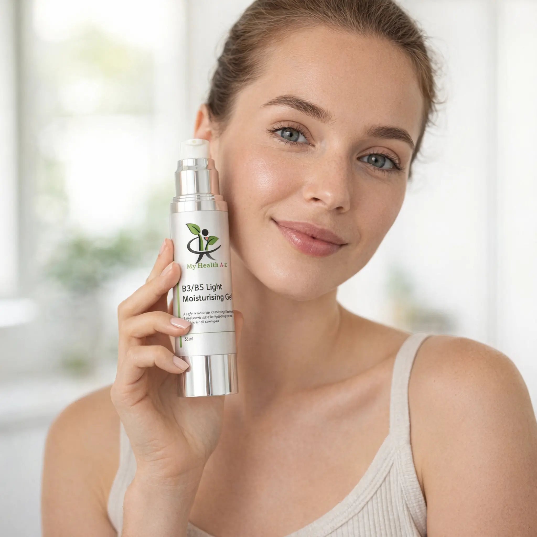 Woman holding My Health A-Z B3/B5 Moisturising Cream skincare product with a blurred background