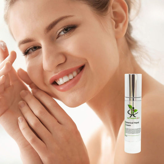 Woman applying cream to her hand with a bottle of Botanical Hand Cream in the corner.