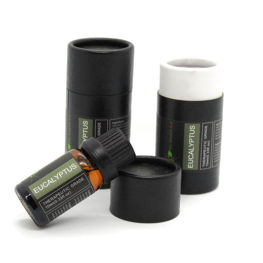 on the left black cylinder on the right open cylinder with bottle resting on the lid