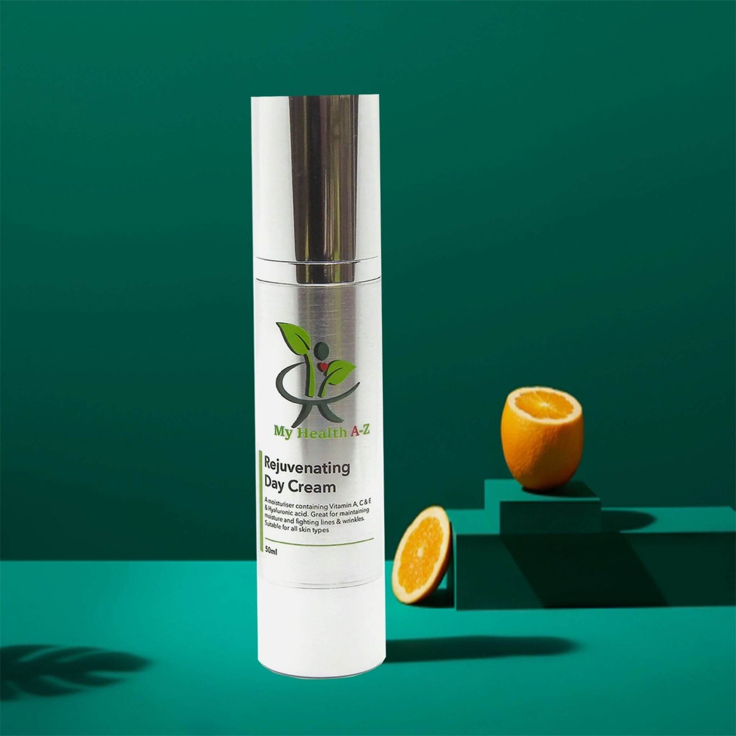 dark green background and a shade of a palm leaf in the middle a bottle rejuvenating day cream on the right a cut organge