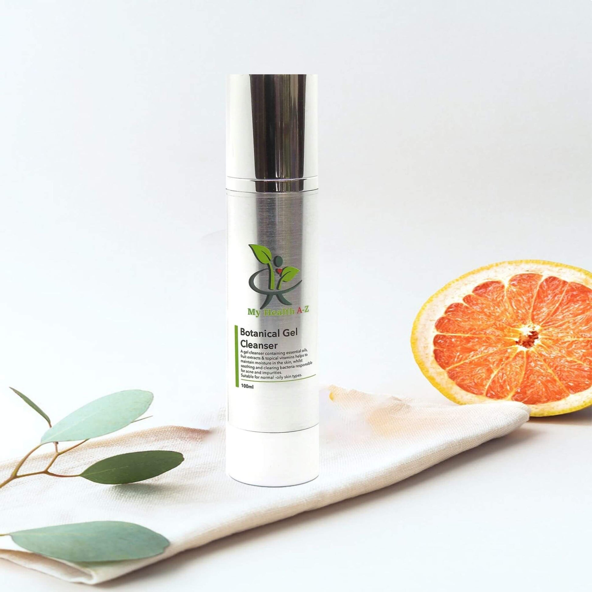 Skincare bottle labelled 'My Natural A-Z'  botanical gel cleanser with a grapefruit and leaves on a white background