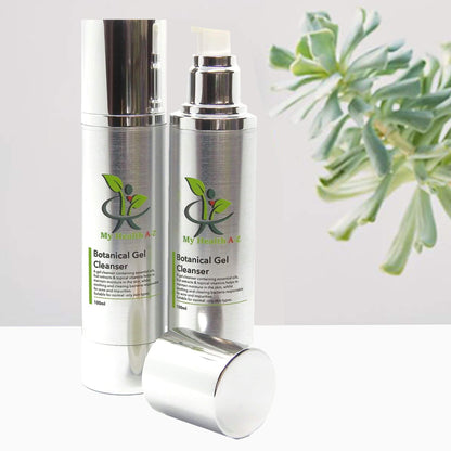 Two bottles of My Botanicals Botanical Gel Cleanser with a plant in the background.