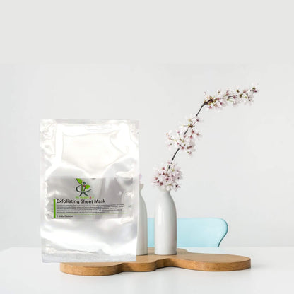 'My Health A-Z' Exfoliating sheet mask packaging on a white surface with a vase and branch in the background
