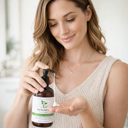 Woman applying liquid from a bottle labeled &