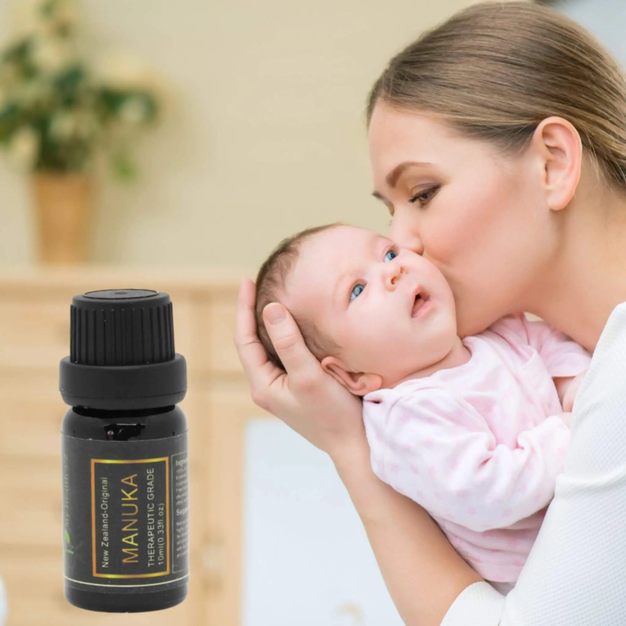 Mother holding baby with My Health A-Z Manuka Essential Oil – gentle antibacterial oil safe for family use