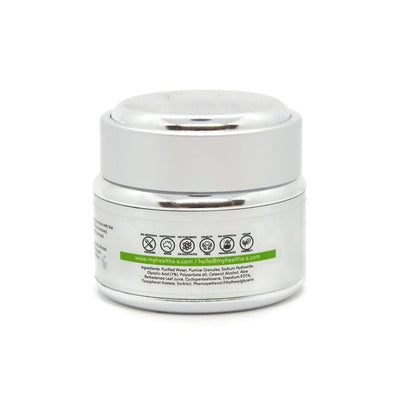 White jar with a silver lid on a white background