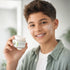 Young boy holding My Health A-Z Pre-Teen Facial Scrub 50g – gentle face scrub for teenage boys