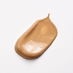 blob of tinted BB cream on a white background